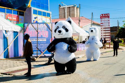 Panda mascots with staff